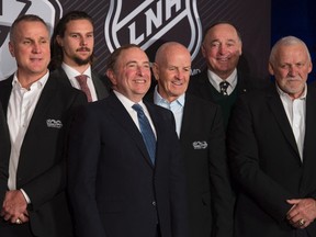 NHL Commissioner Gary Bettman, third from left, and Ottawa Senators defenceman Erik Karlsson, second from left, pose with hockey greats Paul Coffey, left to right, Dave Keon, Frank Mahovlich and Bernie Parent following the announcement of a Heritage Classic game on March 17, 2017 in Ottawa. (THE CANADIAN PRESS/Adrian Wyld)