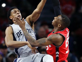 Detroit Pistons guard Ish Smith blocks a shot by Toronto Raptors guard Delon Wright during an NBA game on March 17, 2017. (AP Photo/Duane Burleson)