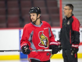 Senators captain Erik Karlsson (left) will not be playing at the next Winter Olympics if the NHL decides against letting players go, according to Eugene Melynyk.