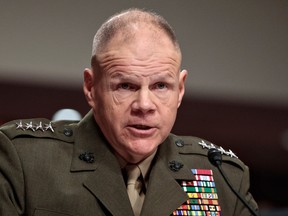 In this March 14, 2017, photo, Marine Corps Commandant Gen. Robert B. Neller speaks on Capitol Hill in Washington, while testifying before the Senate Armed Services Committee hearing on the investigation of nude photographs of female Marines and other women that were shared on the Facebook page "Marines United." At least 20 victims have now come forward to complain that explicit photos of them are being shared online by active duty and retired members of the Marine Corps and others, a leading Navy investigator said March 17. (AP Photo/J. Scott Applewhite)