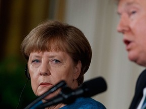 German Chancellor Angela Merkel listens as U.S. President Donald Trump speaks during their joint news conference in the East Room of the White House in Washington, Friday, March 17, 2017. (AP Photo/Evan Vucci)