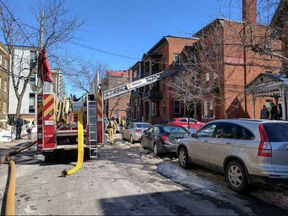 Firefighters at work at a two-alarm fire on Cooper Street Saturday, March 18. (Scott Stilborn, Ottawa Fire Service)