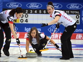 Canada's Rachel Homan (center) throws a stone in a game against China during the World Women's Curling Championship in Beijing, China on Saturday, March 18, 2017. (Chinatopix Via AP)