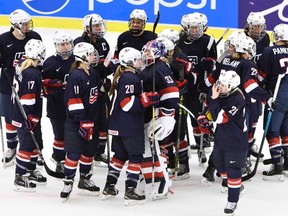 U.S. players celebrate after winning the Women's Hockey World Championship group A match between the USA and Canada in Malmo, Sweden, on March 28, 2015. (AP Photo/TT, Claudio Bresciani)
