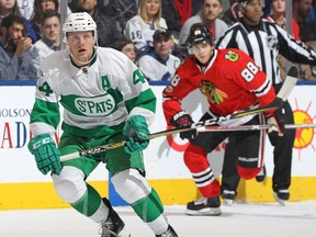 Morgan Rielly (left) of the Maple Leafs skates back for the puck against Patrick Kane (right) of the Blackhawks during NHL action at the Air Canada Centre in Toronto on Saturday, March 18, 2017. (Claus Andersen/Getty Images)