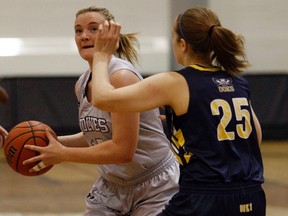 Kassandra Little, left, of the GPRC Wolves women's basketball team, looks towards the basket as she's watched by Rachel Pearce, of the NAIT Ooks on Friday January 20, 2017 in Alberta Colleges Athletic Conference action at Grande Prairie Regional College in Grande Prairie, Alta. The Ooks lost in the bronze medal game of the CCAA championships on Saturday, March 18, 2017.