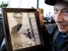 Tom Wood holds up a picture of his father, A. M. ‘Monty’ Wood, who was killed in the line of duty 65 years ago on Saturday March 18, 2017 in Trenton, Ont. Wood's father will have his name added to the The Ontario Police Memorial at Queen’s Park in May. Tim Miller/Belleville Intelligencer/Postmedia Network