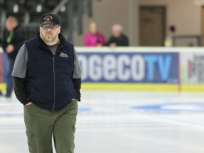 Ice maker Tom Leonard from Sudbury looks over the ice. Volunteers and technicians were busy on January 26, 2017 at the Cobourg Community Centre preparing for the Men's and Women's Provincial Curling Championships which start on Sunday eveningn Cobourg, Ont. Ice technicians were brought in from across the province to convert the hockey rink into a curling rink with five sheets of ice. Officials said by the time they are done flooding there will be approximately 10,000 gallons of water put on the five sheets. Pete Fisher/Northumberland Today/Postmedia Network