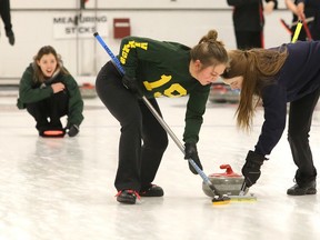 Lockerby Vikings skip Kira Brunton shouts instructions to her team mates Jessica Leonard and Abby Deschene as they sweep her stone during high school curling city championship action in Sudbury, Ont. on Wednesday February 15, 2017. Lockerby defeated St. Charles.Gino Donato/Sudbury Star/Postmedia Network