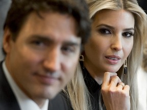 Canadian Prime Minister Justin Trudeau sits alongside Ivanka Trump (R), daughter of US President Donald Trump, during a roundtable discussion on women entrepreneurs and business leaders in the Cabinet Room of the White House in Washington, DC, February 13, 2017. (SAUL LOEB/AFP/Getty Images)