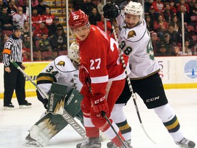 Soo Greyhounds winger Barrett Hayton and London Knights defenceman Victor Mete battle in front of Knights goaltender Tyler Johnson during first-period Ontario Hockey League action Sunday at Essar Centre in Sault Ste. Marie. The Knights lost 6-4. (JEFFREY OUGLER/Postmedia News)