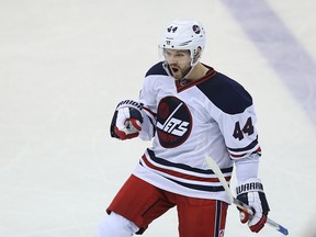 Winnipeg Jets defenceman Josh Morrissey celebrates his game-winning goal against the Minnesota Wild in Winnipeg on March 19, 2017. (Kevin King/Winnipeg Sun/Postmedia Network)