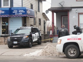 Media is pictured outside 173 Queenston St. after a news conference early Monday morning. Justin Kuijer is wanted for second-degree murderof a seven-year-old St. Catharines boy — a change from first-degree murder — and attempted murder in relation to last Friday’s stabbing at a local bank. (Bob Tymczyszyn/St. Catharines Standard/Postmedia Network)