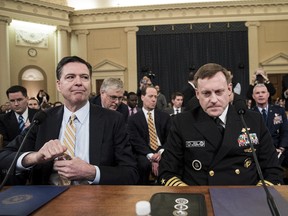 From left to right: James Comey, Director of the Federal Bureau of Investigation (FBI), and Michael Rogers, Director of the National Security Agency, arrive for a House Permanent Select Committee on Intelligence hearing concerning Russian meddling in the 2016 United States election, on Capitol Hill, March 20, 2017 in Washington, D.C. While both the Senate and House Intelligence committees have received private intelligence briefings in recent months, Monday's hearing is the first public hearing on alleged Russian attempts to interfere in the 2016 election. (Photo by Drew Angerer/Getty Images)
