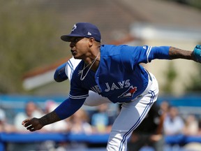 Toronto Blue Jays starting pitcher Marcus Stroman follows through on a pitch to the Tampa Bay Rays during the third inning of a spring training baseball game, Sunday, March 5, 2017, in Dunedin, Fla. (AP Photo/Chris O'Meara)