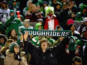 Roughriders fans cheer at Regina's Mosaic Stadium at Taylor Field in October 2016.