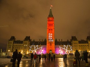 Parliament Hill decked out in light during an evening sound and light show in December. (Wayne Cuddington/Postmedia Network)