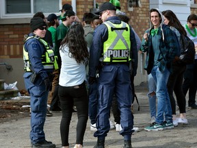 Police presence was heavy on Broughdale Road where several St Patrick's Day parties were held on Friday March 17, 2017. (MORRIS LAMONT, The London Free Press)