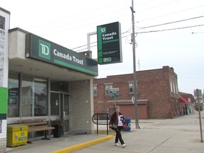 A customer leaves the TD Canada Trust branch Monday in Wyoming, Ont. The branch is scheduled to close in July, ending more than a century of service by the bank in the central Lambton County community. (Paul Morden/Sarnia Observer)