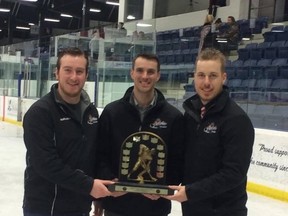 Head coach Mark VanVliet holds the Yeck Division trophy, with his assistant coaches Jordan Fuller (left) and Vance Stark. (Submitted photo)