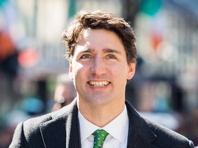 Prime Minister Justin Trudeau smiles as he participates in the annual St. Patrick's Day parade in Montreal, Sunday, March 19, 2017. (THE CANADIAN PRESS/Graham Hughes)