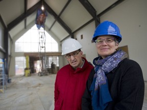 Marietta Drost, executive director of L?Arche London, and member Jim McGeough tour a new facility under construction on Col. Talbot Road in Lambeth Monday. Called the Gathering Place, the 740-square-metre facility will allow L?Arche to double its day programs for adults with developmental disabilities. (MIKE HENSEN, The London Free Press)