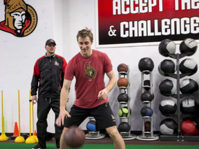 Conditioning coach Chris Schwarz works with Ottawa Senator forward Kyle Turris (R) at the CTC on March 14, 2017.