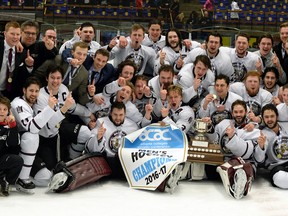 The MacEwan University Griffins men's hockey team poses with the 2016-17 ACAC championship banner following a 4-3 overtim win over the NAIT Ooks in Edmonton on Sunday, March 19, 2017. MacEwan also won the ACAC title in women's hockey this season. It was the men's first championship since 2004. (Len Joudrey/MacEwan Athletics)