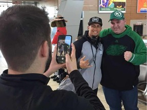 Roughriders receiver/returner Chad Owens (black hat) poses for a picture at Regina International Airport on Monday, March 20, 2017. (Rob Vanstone/Postmedia Network)