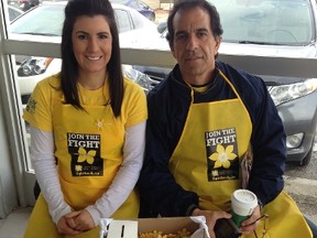 Dana Crispo, an ovarian cancer survivor, and her father, Albert Crispo, sell daffodil pins last April in support of the Canadian Cancer Society. Supplied photo