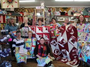 Quilters have always been known to have hearts of gold and locally that is no exception. These are just a few of the many quilters who have been busy making quilts for the Ronald McDonald House Charities. Here they show off their masterpieces. Ellen H (left to right back), Denise Lamarche, Lorraine Leblanc,  Shelly Charron, Lorette Blais, and Christine Doucette. Kneeling are Patsy Cote, Debbie Cote and Joyce Recoskie.