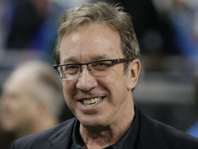 In this Nov. 27, 2014, file photo, comedian Tim Allen is seen on the sidelines before the first half of an NFL football game between the Detroit Lions and the Chicago Bears in Detroit. The Anne Frank Center for Mutual Respect is calling on Tim Allen to apologize for comparing the experience of being a conservative in Hollywood to living in Germany in the 1930s during an appearance on ABC's "Jimmy Kimmel Live" on Friday, March 17, 2017. (AP Photo/Duane Burleson, File)