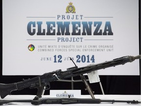 Weapons seized during Project Clemenza are displayed during a news conference at RCMP headquarters in Montreal, Thursday, June 12, 2014. THE CANADIAN PRESS/Graham Hughes