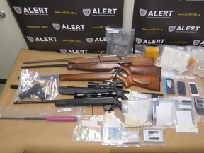 Over $55,000 worth of drugs and 11 firearms have been seized from homes in Lethbridge, Coaldale and Fort Macleod last week. | contributed photo/ALERT