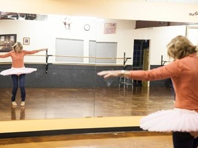 A woman completes a task with her team at Dance Impressions by Ryan during the Amazing Race of Vermilion event on Saturday, March. 18. Taylor Hermiston/Vermilion Standard/Postmedia Network.