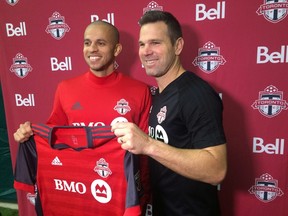 Defender Jason Hernandez (left) with TFC coach Greg Vanney. (The Canadian Press)