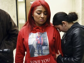 Debora Hernandez, left,mother to Vega's 5-year old daughter Tianna, and Esmeralda Vega, right, sister of murder victim Antonio Vega Jr.L., wait to attend the first appearances of Clarence Williams, 26, and Gerry Thomas, 28, in Passaic County Superior Court, Tuesday, March 21, 2017.  (Amy Newman /The Record via AP)