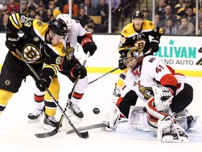 Senators goalie Craig Anderson makes a stop on Bruins' Brad Marchand in Ottawa's 3-2 win on Tuesday. (Getty)