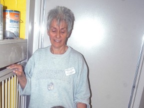 Mary Ann Holland and Susan Arends play with a dog at the Wallaceburg Animal Shelter. The shelter's Animal Rescue Fund (ARF) fundraiser is being held on April 8 at the Moose Lodge.