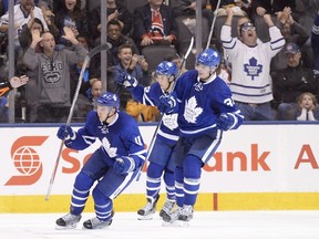 Toronto Maple Leafs' Zach Hyman (11) Auston Matthews (34) and William Nylander (39) celebrate a goal during the third period of NHL hockey pre-season action against the Montreal Canadiens in Toronto on Sunday, October 2, 2016. (CANADIAN PRESS/Frank Gunn)
