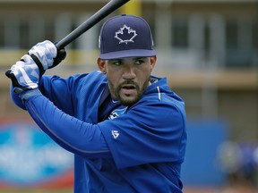Toronto Blue Jays' Devon Travis takes practice in the batting cage before a spring training baseball game against the Boston Red Sox Monday, March 13, 2017, in Dunedin, Fla. (AP Photo/Chris O'Meara)