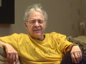 In this Dec. 20, 2002 file photo, Chuck Barris, the man behind TV's "The Dating Game," poses in the lobby of his apartment in New York. Game show impresario Barris has died at 87. Barris, the madcap producer of "The Gong Show" and "The Dating Game," died of natural causes Tuesday afternoon, March 21, 2017, at his home in Palisades, New York. (AP Photo/Bebeto Matthews, File)