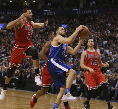Toronto Raptors guard Fred VanVleet (23 with Chicago Bulls guard Michael Carter-Williams (7) and Chicago Bulls forward Paul Zipser (16))in Toronto, Ont. on Tuesday March 21, 2017.  The Toronto Raptors host the Chicago Bulls at the Air Canada Centre in Toronto.