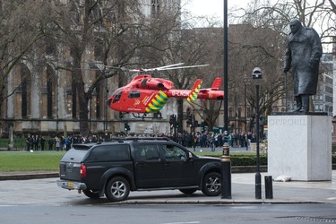 LONDON, ENGLAND - MARCH 22: An Air Ambulance at the scene by  Westminster Bridge and the Houses of Parliament on March 22, 2017 in London, England. A police officer has been stabbed near to the British Parliament and the alleged assailant shot by armed police. Scotland Yard report they have been called to an incident on Westminster Bridge where several people have been injured by a car. (Photo by Jack Taylor/Getty Images)
