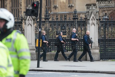 LONDON, ENGLAND - MARCH 22: Armed officers attend to the scene outside the Houses of Parliament on March 22, 2017 in London, England. A police officer has been stabbed near to the British Parliament and the alleged assailant shot by armed police. Scotland Yard report they have been called to an incident on Westminster Bridge where several people have been injured by a car. (Photo by Jack Taylor/Getty Images)