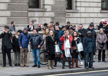 LONDON, ENGLAND - MARCH 22: Members of the public look on as roads are closed off by Police around Westminster Bridge and the Houses of Parliament on March 22, 2017 in London, England. A police officer has been stabbed near to the British Parliament and the alleged assailant shot by armed police. Scotland Yard report they have been called to an incident on Westminster Bridge where several people have been injured by a car. (Photo by Jack Taylor/Getty Images)