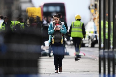 LONDON, ENGLAND - MARCH 22:  A member of the public is seen near Westminster Bridge on March 22, 2017 in London, England. A police officer has been stabbed near to the British Parliament and the alleged assailant shot by armed police. Scotland Yard report they have been called to an incident on Westminster Bridge where several people have been injured by a car.  (Photo by Carl Court/Getty Images)