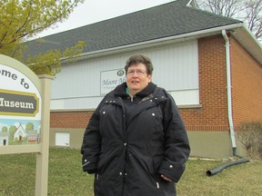 Curator Laurie Mason stands Wednesday outside the Moore Museum in Mooretown. The museum is calling on Lambton County artists to submit proposals for a mural for the front outside wall of its main building. Paul Morden/Sarnia Observer/Postmedia Network