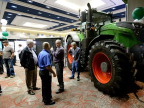 Farmers congregate at the London Convention Centre for the Grain Farmers of Ontario Convention on Tuesday. The group is studying the economic impact of the province’s “rash” ban on neonics and has launched a PR campaign. (MORRIS LAMONT, The London Free Press)