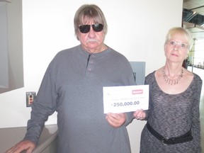 Sarnia residents Gary Ostrowercha and Claire Garner are pictured here picking up their winnings from the OLG. The pair won $250,000 by playing the Instant Super Money Multiplier. The winning ticket was purchased at Point Variety in Point Edward. (Handout)